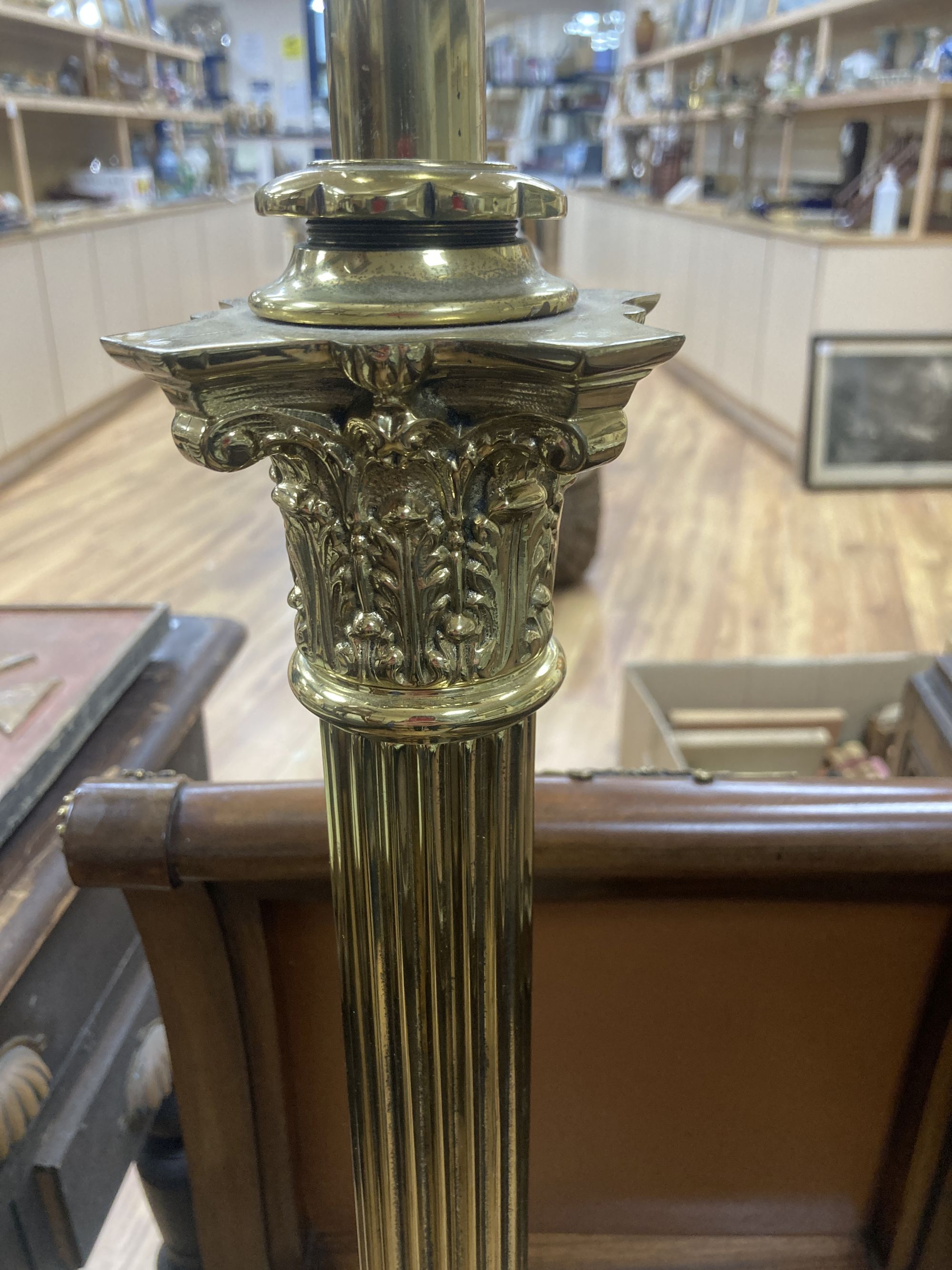 A Corinthian column brass telescopic standard lamp